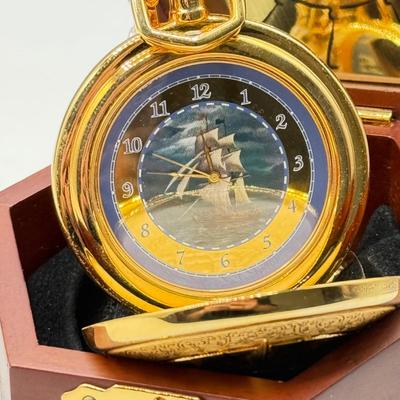 LOT 120: Franklin Mint Chocolate El Cazador Pocket Watch, Coastal Navigation & Piloting Guides