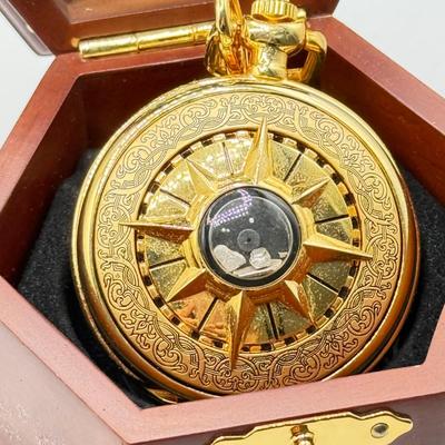 LOT 120: Franklin Mint Chocolate El Cazador Pocket Watch, Coastal Navigation & Piloting Guides