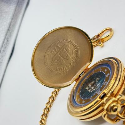 LOT 120: Franklin Mint Chocolate El Cazador Pocket Watch, Coastal Navigation & Piloting Guides