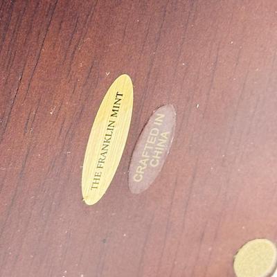 LOT 120: Franklin Mint Chocolate El Cazador Pocket Watch, Coastal Navigation & Piloting Guides