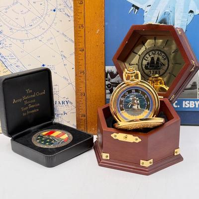 LOT 120: Franklin Mint Chocolate El Cazador Pocket Watch, Coastal Navigation & Piloting Guides