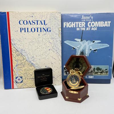 LOT 120: Franklin Mint Chocolate El Cazador Pocket Watch, Coastal Navigation & Piloting Guides