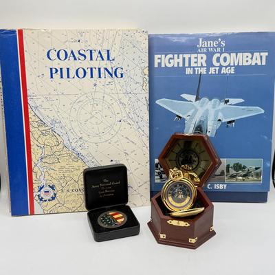LOT 120: Franklin Mint Chocolate El Cazador Pocket Watch, Coastal Navigation & Piloting Guides