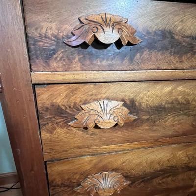 Walnut 4-Drawer Dresser with "fruit and nut" pulls.