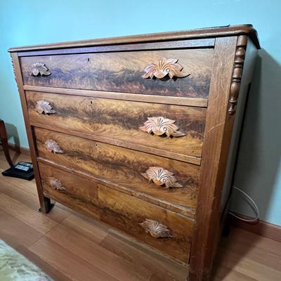Walnut 4-Drawer Dresser with "fruit and nut" pulls.