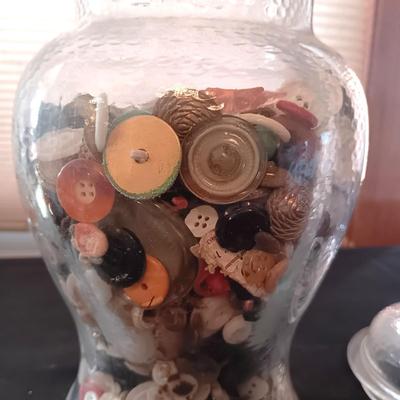 GLASS CONTAINER FILLED WITH A VARIETY OF BUTTONS