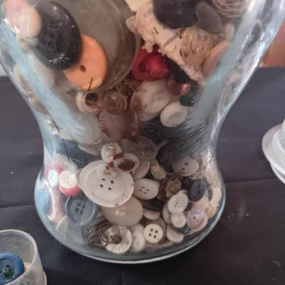GLASS CONTAINER FILLED WITH A VARIETY OF BUTTONS