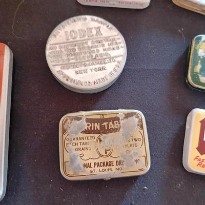 A COLLECTION OF OLD TINS
