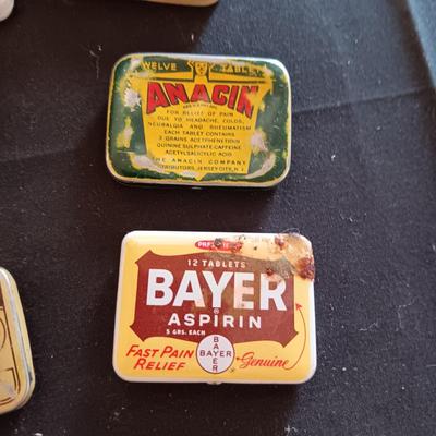 A COLLECTION OF OLD TINS