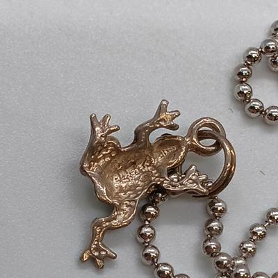 LOT 39: Sterling Silver Collection - Frog Pendant with Gemstones, Sun Shaped Perfume Pendant, Textured Braid Ring & More