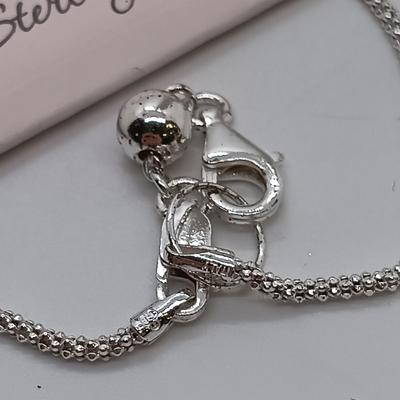 LOT 39: Sterling Silver Collection - Frog Pendant with Gemstones, Sun Shaped Perfume Pendant, Textured Braid Ring & More