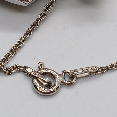 LOT 39: Sterling Silver Collection - Frog Pendant with Gemstones, Sun Shaped Perfume Pendant, Textured Braid Ring & More