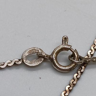 LOT 39: Sterling Silver Collection - Frog Pendant with Gemstones, Sun Shaped Perfume Pendant, Textured Braid Ring & More