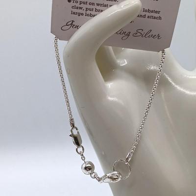 LOT 39: Sterling Silver Collection - Frog Pendant with Gemstones, Sun Shaped Perfume Pendant, Textured Braid Ring & More