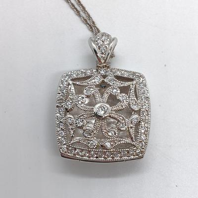 LOT 39: Sterling Silver Collection - Frog Pendant with Gemstones, Sun Shaped Perfume Pendant, Textured Braid Ring & More