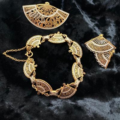 LOT 77: Beautiful Collection of Vintage Jewelry - Damascene Three Piece Set, Brooch and Gold Tone Earrings