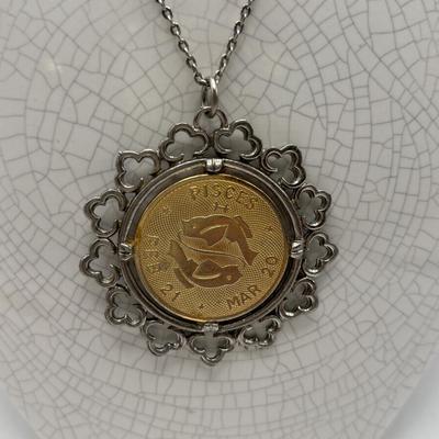 LOT 96: Vintage Pendant/Necklace Collection: Trifari Pisces Etched Glass Zodiac, Barbados Cut-out Coin, Gold/Silver Tone Pisces Zodiac...