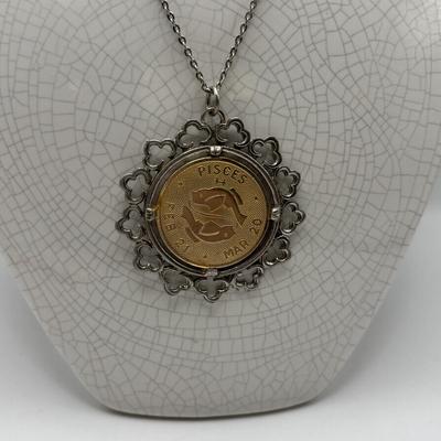 LOT 96: Vintage Pendant/Necklace Collection: Trifari Pisces Etched Glass Zodiac, Barbados Cut-out Coin, Gold/Silver Tone Pisces Zodiac...