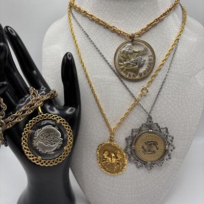 LOT 96: Vintage Pendant/Necklace Collection: Trifari Pisces Etched Glass Zodiac, Barbados Cut-out Coin, Gold/Silver Tone Pisces Zodiac...