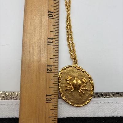 LOT 96: Vintage Pendant/Necklace Collection: Trifari Pisces Etched Glass Zodiac, Barbados Cut-out Coin, Gold/Silver Tone Pisces Zodiac...