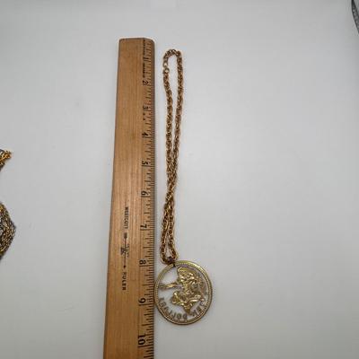 LOT 96: Vintage Pendant/Necklace Collection: Trifari Pisces Etched Glass Zodiac, Barbados Cut-out Coin, Gold/Silver Tone Pisces Zodiac...