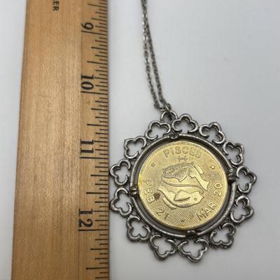 LOT 96: Vintage Pendant/Necklace Collection: Trifari Pisces Etched Glass Zodiac, Barbados Cut-out Coin, Gold/Silver Tone Pisces Zodiac...