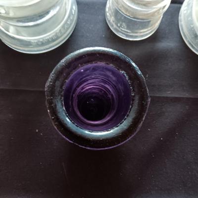 1 PURPLE AND 3 CLEAR INSULATORS