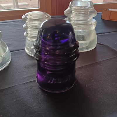 1 PURPLE AND 3 CLEAR INSULATORS