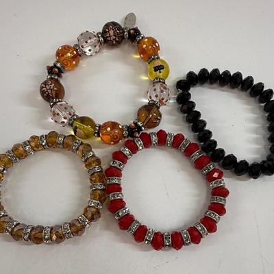 Sale Photo Thumbnail #45: Lot of four stretch-style bracelets, all in good condition.