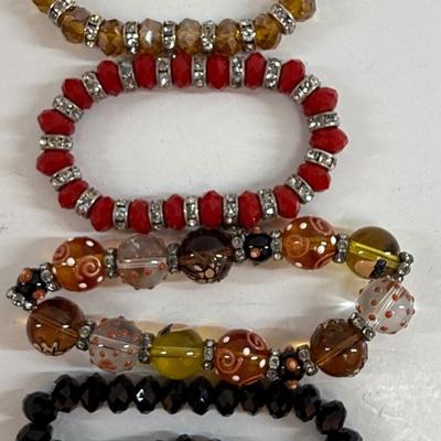 Sale Photo Thumbnail #43: Lot of four stretch-style bracelets, all in good condition.