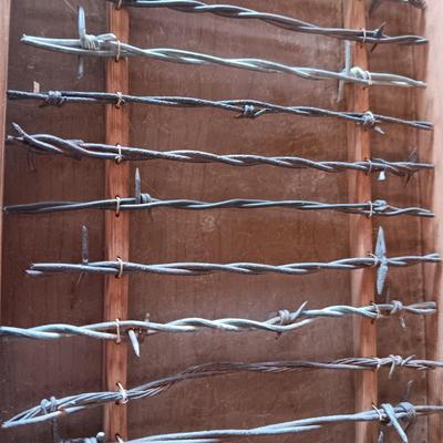 BARBED WIRE SAMPLER AND A SIGNED COPY OF THE BOOK THE "BOBBED WIRE" VIII BIBLE BY JACK GLOVER