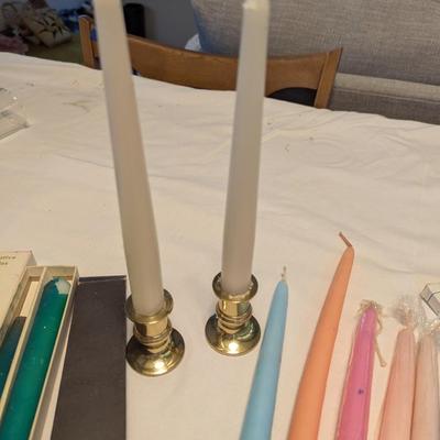 Large group of candles in multiple colors.