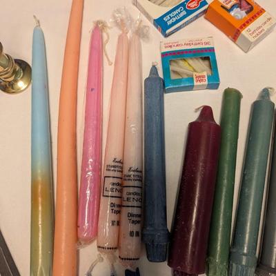 Large group of candles in multiple colors.