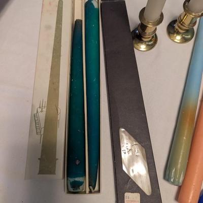 Large group of candles in multiple colors.