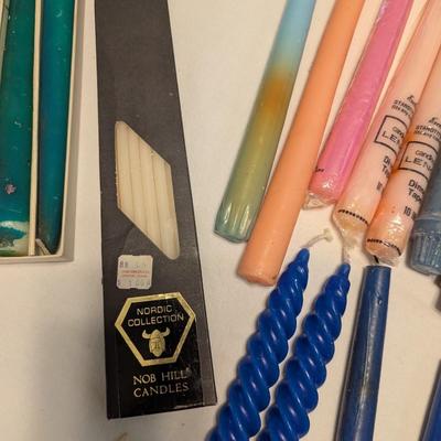 Large group of candles in multiple colors.