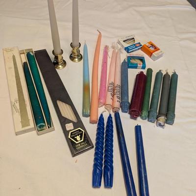 Large group of candles in multiple colors.