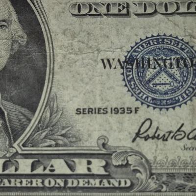 Sale Photo Thumbnail #31: 1935F $1 Silver Certificate ERROR   no "IN GOD WE TRUST" on back this bill is in fair condition