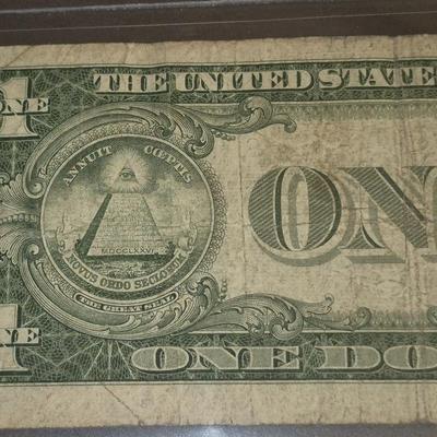 Sale Photo Thumbnail #35: 1935F $1 Silver Certificate ERROR   no "IN GOD WE TRUST" on back this bill is in fair condition