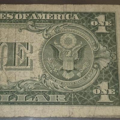 Sale Photo Thumbnail #34: 1935F $1 Silver Certificate ERROR   no "IN GOD WE TRUST" on back this bill is in fair condition