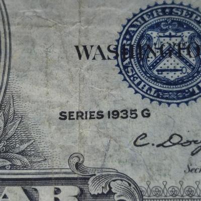 Sale Photo Thumbnail #40: 1935G $1 Silver Certificate STAR NOTE. no "IN GOD WE TRUST" on Back. This bill is in fair condition