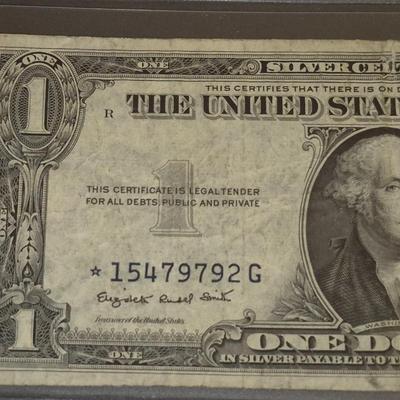 Sale Photo Thumbnail #41: 1935G $1 Silver Certificate STAR NOTE. no "IN GOD WE TRUST" on Back. This bill is in fair condition
