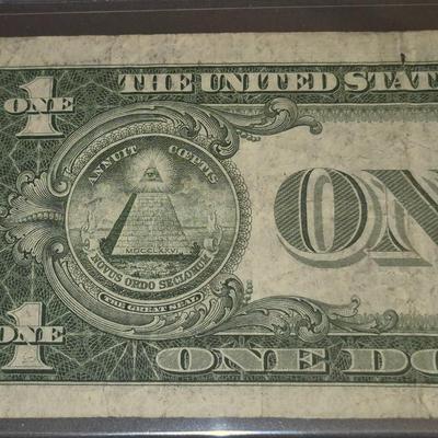 Sale Photo Thumbnail #43: 1935G $1 Silver Certificate STAR NOTE. no "IN GOD WE TRUST" on Back. This bill is in fair condition