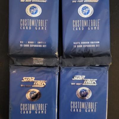 Sale Photo Thumbnail #137: Star Trek Customizable Card Game White Border Edition 15 Card Expansion Set (One set does have a tear as pictured)