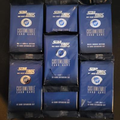 Sale Photo Thumbnail #136: Star Trek Customizable Card Game White Border Edition 15 Card Expansion Set (One set does have a tear as pictured)