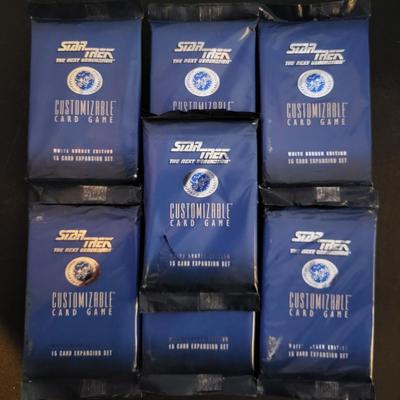 Sale Photo Thumbnail #142: Star Trek Customizable Card Game White Border Edition 15 Card Expansion Set (One set does have a tear as pictured)