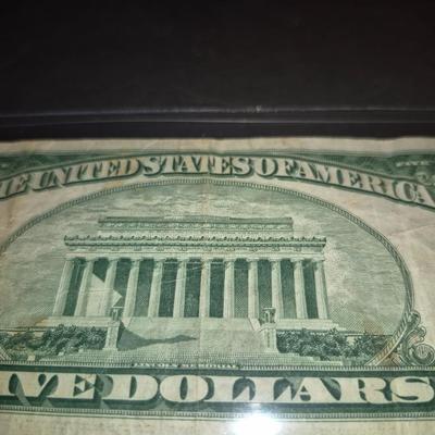 Sale Photo Thumbnail #298: 1953 Red Seal $5 Bill. This is the last year that there was no motto on the back.