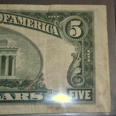 Sale Photo Thumbnail #296: 1953 Red Seal $5 Bill. This is the last year that there was no motto on the back.