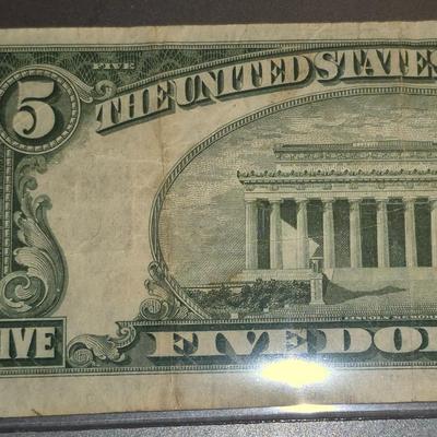 Sale Photo Thumbnail #297: 1953 Red Seal $5 Bill. This is the last year that there was no motto on the back.