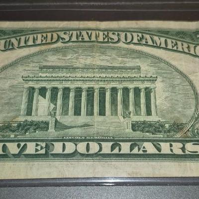 Sale Photo Thumbnail #300: 1953 Red Seal $5 Bill. This is the last year that there was no motto on the back.