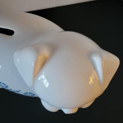 Sale Photo Thumbnail #521: Vintage 1980's Cornflower Blue Piggy Bank England (has a crack but may be from age as pictured)
6 3/4" long 
4 3/4" tall